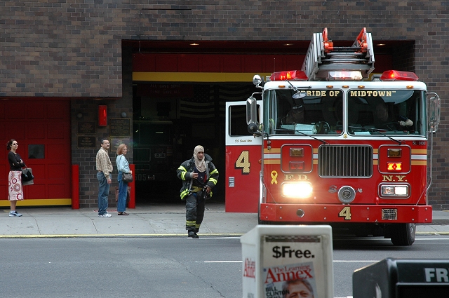 Fire fighter running to the truck, New York City